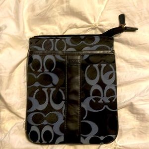 Used coach measuring 8 1/2” x 7” navy blue l am not pos  of its authenticity